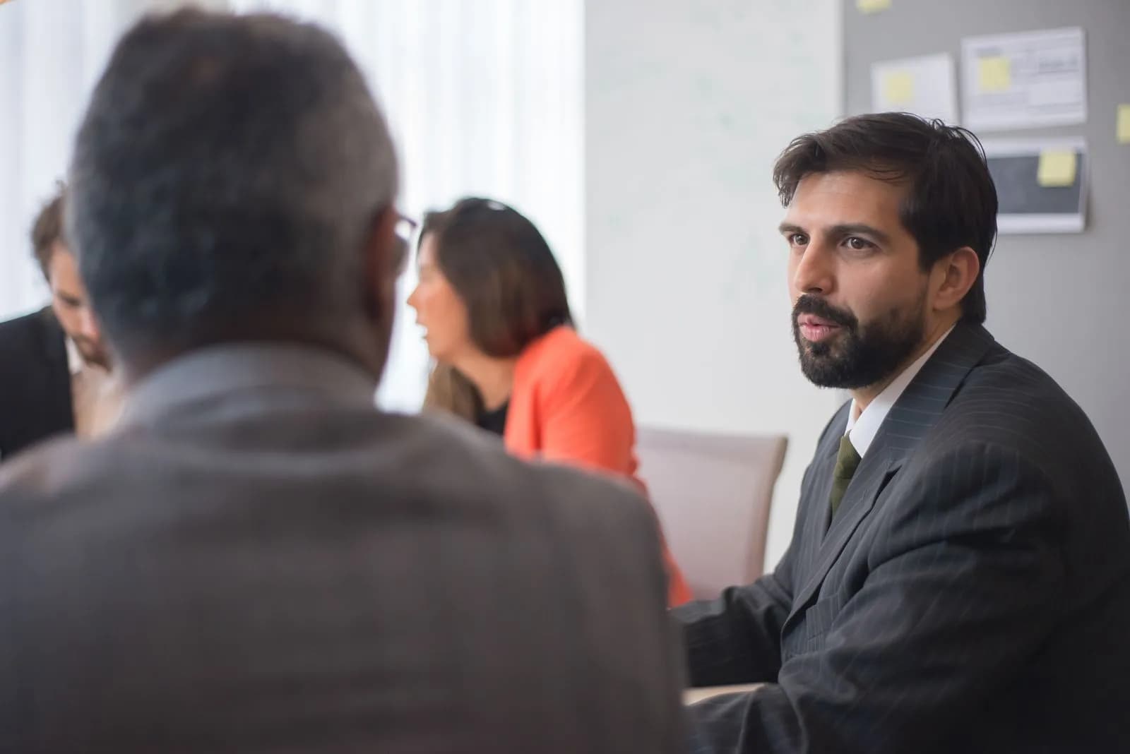 Diverse business team collaborating during an office meeting. ...