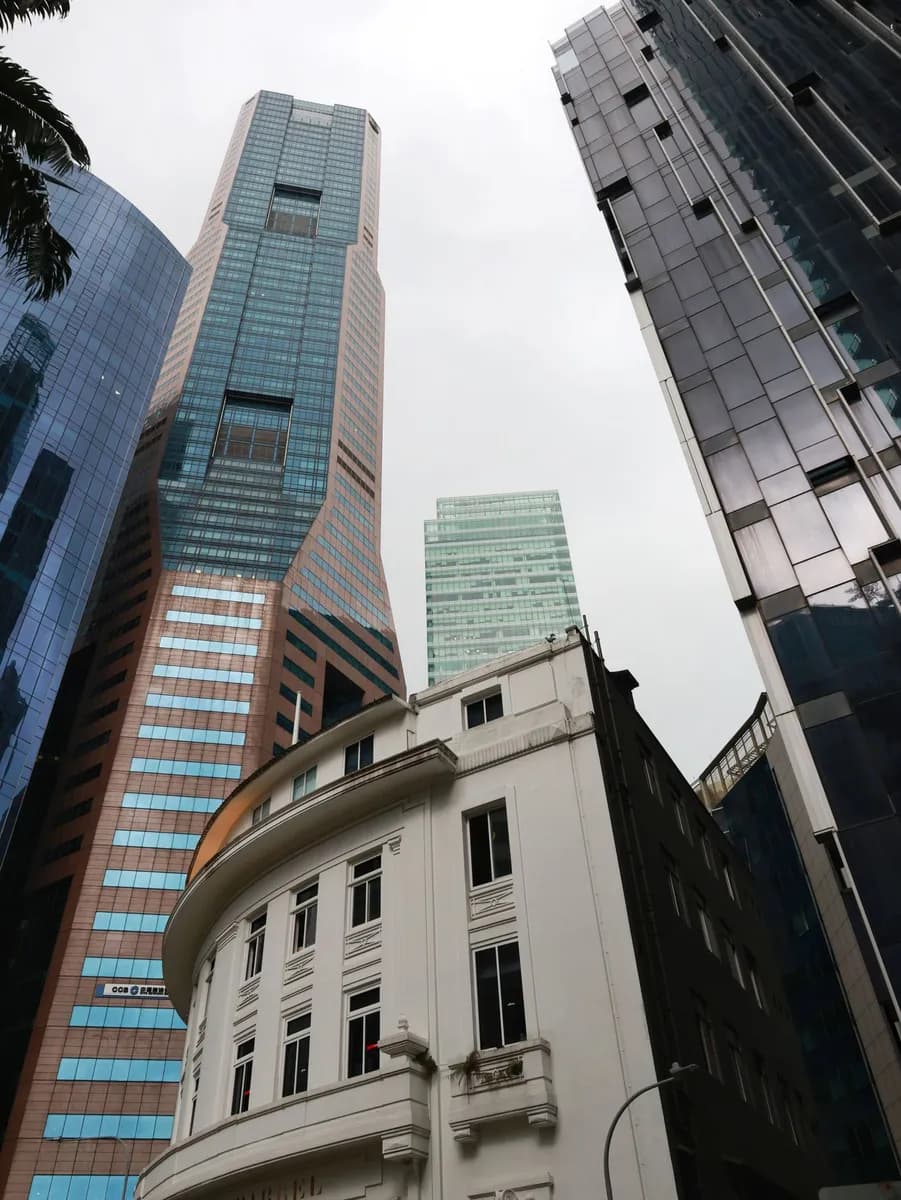 Captivating view of towering skyscrapers in Singapore's bustling financial district, featuring modern architecture.